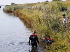 Police search a waterway for body remains related to the ongoing Kim Wall murder investigation at the west coast of Amager close to Copenhagen, Denmark, Wednesday, Aug. 23, 2017