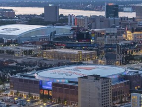 In an undated photo provided by Olympia Development of Michigan, Little Caesars Arena, foreground, is seen in Detroit with Ford Field and Comerica Park in the background. Chris Ilitch looked and sounded like an excited tour guide for nearly two hours, giving The Associated Press an exclusive look inside Little Caesars Arena. The future home of the Detroit Red Wings and Pistons is the gem of a $1.2 billion, 55-block development dubbed The District Detroit. (Rob Kohn/Olympia Development of Michigan via AP)