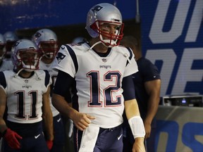 New England Patriots quarterback Tom Brady leads the team onto the field for an NFL preseason football game against the Detroit Lions, Friday, Aug. 25, 2017, in Detroit. (AP Photo/Carlos Osorio)
