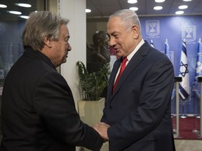 Prime Minister Benjamin Netanyahu, right, and U.N. Secretary-General Antonio Guterres shake hands before a press conference at the Prime Minister's Office in Jerusalem, Monday , Aug.28, 2017.