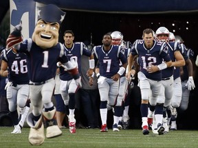 New England Patriots quarterback Tom Brady (12) leads his team onto the field for an NFL preseason football game against the Jacksonville Jaguars, Thursday, Aug. 10, 2017, in Foxborough, Mass. (AP Photo/Mary Schwalm)
