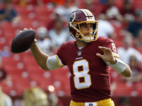 Washington Redskins quarterback Kirk Cousins throws to a receiver in the first half of a preseason NFL football game against the Cincinnati Bengals, Sunday, Aug. 27, 2017, in Landover, Md. (AP Photo/Alex Brandon)