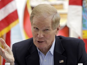 Sen. Bill Nelson, D-Fla., talks to a group of Haitian community leaders, Friday, Aug. 25, 2017, in the Little Haiti area in Miami.  Nelson called on the administration to extend Temporary Protected Status for the nearly 60,000 Haitians living in the U.S. until at least July, 2019. Such extensions are typically renewed for 18-month intervals, but the latest announcement in May said it would expire in six months. Haitians granted the protection can live and work in the U.S. without fear of deportation. (AP Photo/Alan Diaz)