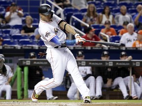 Miami Marlins' Giancarlo Stanton hits a two-run home run during the first inning of a baseball game against the San Francisco Giants, Monday, Aug. 14, 2017, in Miami. (AP Photo/Lynne Sladky)