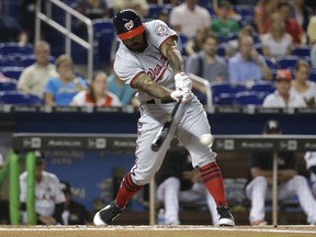 Washington Nationals' Howie Kendrick hits a single during the first inning against the Miami Marlins in a baseball game Tuesday, Aug. 1, 2017, in Miami. (AP Photo/Lynne Sladky)