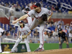 Washington Nationals starting pitcher Max Scherzer follows through on a delivery during the first inning of the team's baseball game against the Miami Marlins, Tuesday, Aug. 1, 2017, in Miami. (AP Photo/Lynne Sladky)