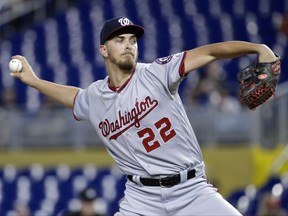 Washington Nationals starting pitcher A.J. Cole delivers during the first inning of the team's baseball game against the Miami Marlins, Wednesday, Aug. 2, 2017, in Miami. (AP Photo/Lynne Sladky)