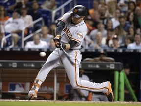 San Francisco Giants' Ryder Jones hits a double during the fifth inning of a baseball game against the Miami Marlins, Tuesday, Aug. 15, 2017, in Miami. (AP Photo/Lynne Sladky)