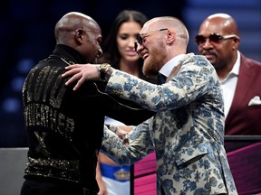 Floyd Mayweather (left) and Conor McGregor shake hands after their boxing match in Las Vegas on Aug. 26.