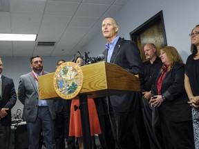 Florida Gov. Rick Scott speaks to reporters during a news conference at ThinkAnew Tuesday, Aug. 8, 2017 in Tampa. ThinkAnew, which recently opened offices in Tampa, specializes in offering information technology services mainly for small to midsize healthcare companies. (Chris Urso/Tampa Bay Times via AP)