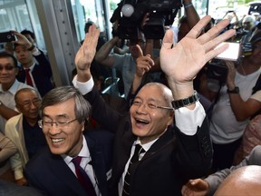 Pastor Hyeon Soo Lim waves to the congregation as he arrives at the Light Presbyterian Church in Mississauga, Ont., Sunday, August 13, 2017. Lim was released last week from prison in North Korea, where he had been serving a life sentence with hard labour for anti-state activities. THE CANADIAN PRESS/Frank Gunn