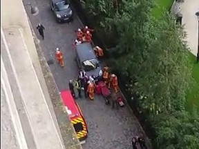 In this image provided by Nadia Leprohon members of the emergency services attend the scene where French soldiers were hit and injured by a vehicle in the western Paris suburb of Levallois-Perret near Paris, France, Wednesday, Aug. 9, 2017