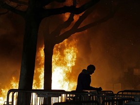 A fire set by demonstrators protesting a scheduled speaking appearance by Milo Yiannopoulos burns on Sproul Plaza on the University of California, Berkeley campus ON Feb. 1, 2017.