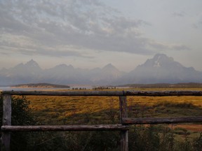 FILE - In this Aug. 26, 2016 file photo, the morning sun illuminates the Grand Tetons in Grand Teton National Park, north of Jackson Hole, Wyo. Grand Teton National Park, normally in the shadow of the neighboring and world-renowned Yellowstone National Park in northwest Wyoming, is set to get its day in the sun with next week's total solar eclipse passing directly over the park. (AP Photo/Brennan Linsley, File)