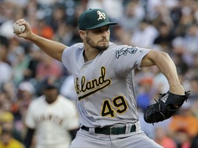 Oakland Athletics pitcher Kendall Graveman throws to a San Francisco Giants batter during the first inning of a baseball game in San Francisco, Thursday, Aug. 3, 2017. (AP Photo/Jeff Chiu)