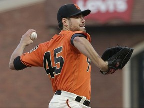 San Francisco Giants pitcher Matt Moore throws against the Philadelphia Phillies during the first inning of a baseball game in San Francisco, Friday, Aug. 18, 2017. (AP Photo/Jeff Chiu)