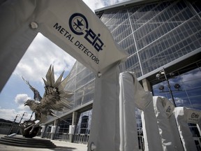 Metal detectors stand outside Mercedes-Benz Stadium, the new home of the Atlanta Falcons football team and the Atlanta United soccer team, in preparation for its opening in Atlanta, Tuesday, Aug. 15, 2017. The stadium will open to the public for the first time at an Aug. 26 Falcons preseason game. (AP Photo/David Goldman)