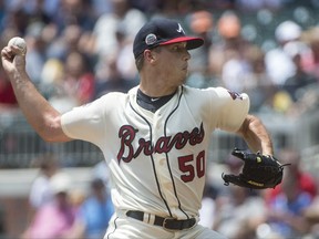 Atlanta Braves' Lucas Sims pitches against the Miami Marlins during the first inning of a baseball game, Sunday, Aug. 6, 2017, in Atlanta. (AP Photo/John Amis)