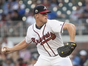 Atlanta Braves' Lucas Sims pitches against the Seattle Mariners during the first inning of a baseball game, Tuesday, Aug. 22, 2017, in Atlanta. (AP Photo/John Amis)