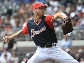 Atlanta Braves' Mike Foltynewicz pitches against the Colorado Rockies during the first inning of a baseball game, Sunday, Aug. 27, 2017, in Atlanta. (AP Photo/John Amis)