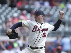 Atlanta Braves starting pitcher Sean Newcomb (51) works against Cincinnati Reds in the first inning of a baseball game, Sunday, Aug. 20, 2017, in Atlanta. (AP Photo/John Bazemore)