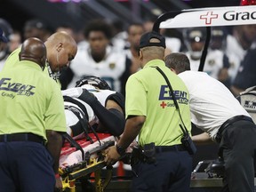Jacksonville Jaguars' Jarrod Harper (35) is attended to by medical staff after an injury during the first half of an NFL football game against the Atlanta Falcons, Thursday, Aug. 31, 2017, in Atlanta. (AP Photo/John Bazemore)