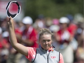 Canada's Brooke Henderson acknowledges the gallery after sinking a putt on the 18th green during third round play at the Canadian Pacific Women's Open in Ottawa on Saturday, Aug. 26, 2017.
