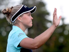 Brooke Henderson salutes the crowd after finishing her final round at the CP Women's Open in Ottawa on Aug. 27.
