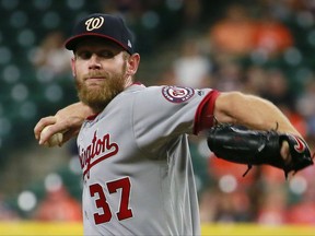 Washington Nationals' Stephen Strasburg delivers a pitch to the Houston Astros during the first inning of a baseball game Thursday, Aug. 24, 2017, in Houston. (AP Photo/Richard Carson)