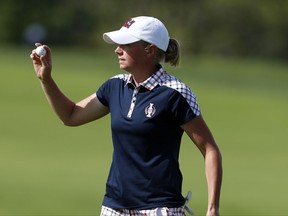 United States' Stacy Lewis reacts after making her putt on the first green during her singles match against Europe's Catriona Matthew, of Scotland, in the Solheim Cup golf tournament, Sunday, Aug. 20, 2017, in West Des Moines, Iowa. (AP Photo/Charlie Neibergall)