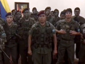 TV grab taken from a video posted on social media shows a man who presented himself as army captain Juan Caguaripyano at an army base used by the National Bolivarian Armed Forces in the Venezuela's third city of Valencia.