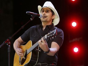 FILE - In this June 2, 2017 file photo, Country music recording artist Brad Paisley performs at the graduation for Barrington High School, at Willow Creek Community Church in South Barrington, Ill. Paisley says years of hosting the Country Music Awards and writing songs with humorous lyrics have - hopefully - prepared him to host his first comedy special, the "Brad Paisley Comedy Rodeo," which will premiere on Netflix on Tuesday, Aug. 15. (Steve Lundy /Daily Herald via AP, File)