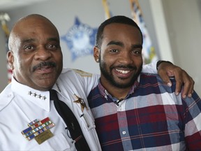In this Monday, Aug. 28, 2017 photo, Chicago police Superintendent Eddie Johnson, left, and his son Daniel Johnson pose for a photo in Superintendent Johnson's office at Chicago Police Department headquarters. Daniel Johnson is donating a kidney to his father. (Chris Walker/Chicago Tribune via AP)
