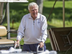 FILE - In this June 13, 2016, file photo, former Notre Dame football coach Ara Parseghian makes his way to an interview area during the Kelly Cares Foundation Golf Invitational at Lost Dunes Golf Club in Bridgman, Mich. Parseghian died Wednesday, Aug. 2, 2017, at his home in Granger, Ind. He was 94.  (Robert Franklin/South Bend Tribune via AP, File)