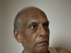 In this Aug. 2, 2017 photo, Sohinder Nath Chopra, 81, sits inside his house in New Delhi, India. Chopra still has vivid dreams of his old village near Gujranwala in present day Pakistan. A village he and his Hindu family had to flee overnight, guarded by their Christian servant, after the local Muslim cleric suggested it would be best for them to leave. He was 12 at the time. (AP Photo/Tsering Topgyal)