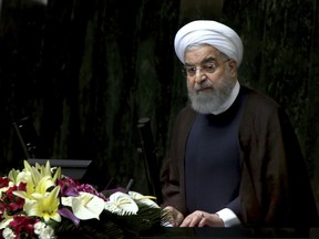 Iranian President Hassan Rouhani speaks in a session of parliament to debate his proposed cabinet, in Tehran, Iran, Tuesday, Aug. 15, 2017