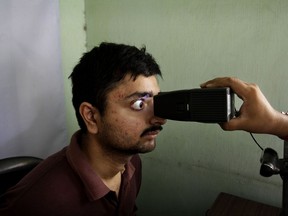 FILE- In this May 16, 2012 file photo, an Indian man gets his retina scanned as he enrolls for Aadhar, India's unique identification project in Kolkata, India. India's top court has ruled that the right to privacy is a fundamental right of every citizen of the country. The landmark verdict was in response to many petitions filed in courts questioning the validity of a government scheme to assign a unique biometric identity card to every individual. (AP Photo/Bikas Das, File)