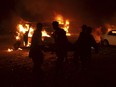 Pakistani volunteers and soldiers carry a blast victim in Quetta, Pakistan, Saturday, Aug. 12, 2017. Pakistan's army says "terrorists" have targeted a military truck with a bomb killing many soldiers and civilians.