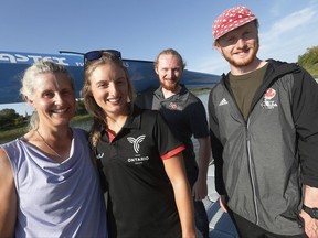 Members of the Vincent family, from left, Fiona, Lexy, Kenzie and Fearghus (father Mike is missing) carry their boats beside the Red River at the Manitoba Canoe and Kayak Centre, home of the Canada Games races, Sunday, August 6, 2017. Kayaking runs deep in the Vincent family at this summer's Canada Games and beyond. THE CANADIAN PRESS/John Woods