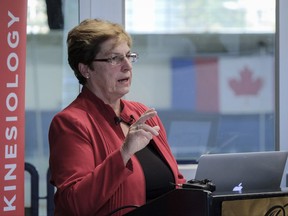 Dr. Joan Vickers, a researcher at the University of Calgary, announces the results of a study examining the effectiveness of a warning line painted on the ice to reduce injuries to hockey players, in Calgary, Alta., Tuesday, Aug. 29, 2017.THE CANADIAN PRESS/Jeff McIntosh