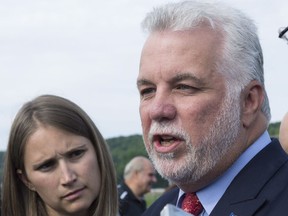 Quebec Premier Philippe Couillard responds to reporters questions after a nomination news conference, Tuesday, August 15, 2017 in Quebec City. THE CANADIAN PRESS/Jacques Boissinot