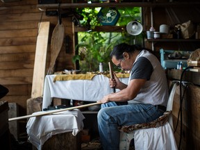 Sandford Williams of the Mowachaht First Nations carves in his shed where he resides during the summer in Friendly Cove, British Columbia