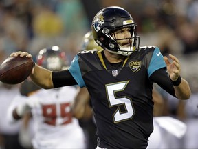 Jacksonville Jaguars quarterback Blake Bortles (5) throws a pass for a first down against the Tampa Bay Buccaneers during the first half of an NFL preseason football game, Thursday, Aug. 17, 2017, in Jacksonville, Fla. (AP Photo/John Raoux)