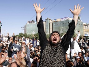 Protesters shout slogans during a demonstration in western Herat province of Afghanistan, Wednesday, Aug. 2, 2017. Thousands of angry residents carried the bodies of 31 people who died in a horrific suicide attack on a Shiite Mosque in western Herat. (AP Photo/Hamed Sarfarazi)