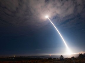 In this image taken with a slow shutter speed and provided by Vandenberg Air Force Base, an unarmed Minuteman 3 missile launches from Vandenberg Air Force Base, Calif.,  Wednesday, Aug. 2, 2107. The U.S. Air Force has successfully launched the unarmed intercontinental ballistic missile, the fourth such test this year. (Senior Airman Ian Dudley/Vandenberg Air Force Base via AP)