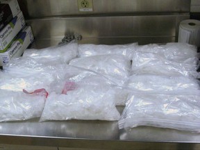 This undated photo provided by the U.S. Border Patrol shows 12 packages of methamphetamine that were confiscated from a U.S. citizen after a border patrol agent spotted a remote-controlled drone swooping over the border fence Tuesday, Aug. 8, 2017 at a border crossing near San Diego, Calif. Authorities have arrested a man they say used the drone to fly drugs across the Mexican border into California. (U.S. Border Patrol via AP)
