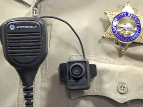 FILE - This Sept. 22, 2014 file photo shows a body camera on the uniform of a Los Angeles County Sheriff's deputy at department headquarters in Monterey Park, Calif. The largest sheriff's department in the U.S. doesn't have a policy for body cameras after years of studying the issue. So hundreds, and perhaps thousands, of deputies have taken matters into their own hands and purchased the cameras themselves. The camera shown may not be the type that deputies are currently buying on their own. (AP Photo/ Nick Ut, File)
