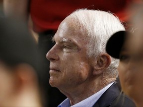 FILE - In this Aug 10, 2017, file photo, Sen. John McCain, R-Ariz., watches a baseball game between the Arizona Diamondbacks and the Los Angeles Dodgers during the first inning in Phoenix. McCain's packed agenda while on break from Congress in his home state of Arizona has hardly been the schedule of a typical brain cancer patient, or even someone about to turn 81. McCain has been undergoing targeted radiation and chemotherapy treatments at the local Mayo Clinic on weekday mornings before going about his day with vigor. (AP Photo/Ross D. Franklin, File)