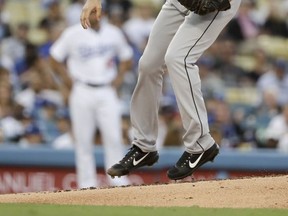 Chicago White Sox starting pitcher Miguel Gonzalez throws against the Los Angeles Dodgers during the first inning of a baseball game in Los Angeles, Tuesday, Aug. 15, 2017. (AP Photo/Chris Carlson)