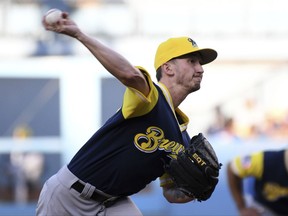 Milwaukee Brewers pitcher Zach Davies throws during the first inning of a baseball game against the Los Angeles Dodgers, Saturday, Aug. 26, 2017, in Los Angeles. (AP Photo/Michael Owen Baker)